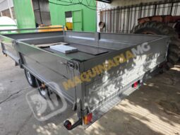 REMOLQUE EN BATEA DE DOBLE EJE lleno