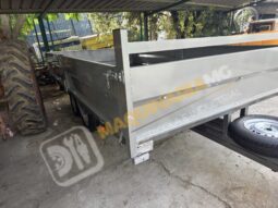 REMOLQUE EN BATEA DE DOBLE EJE lleno